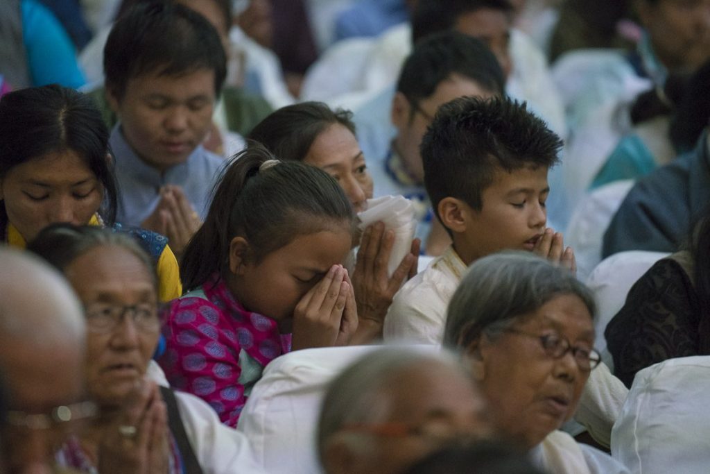 Tibetan community from Phuntsokling settlement listening to His Holiness
