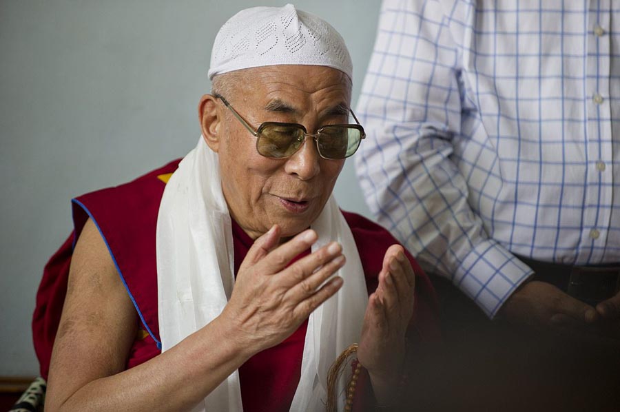 Tibetan spiritual leader the Dalai Lama offers prayer at Hijrat Mosque at the Tibetan settlement in Srinagar, India, on 14 July 2012.