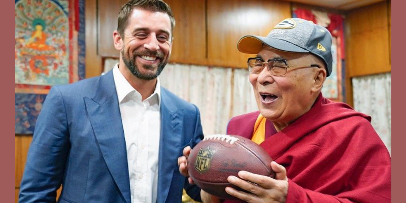 American Footballer Presents Cap, Ball to Dalai Lama