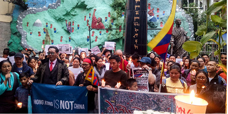 China Warns 8 Years Imprisonment for Tibetans Sharing Hong Kong News