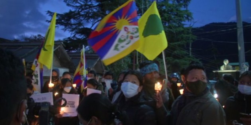 Tibetans gather in Dharamshala for a vigil, calling on China to halt its “repressive actions in Tibet.”